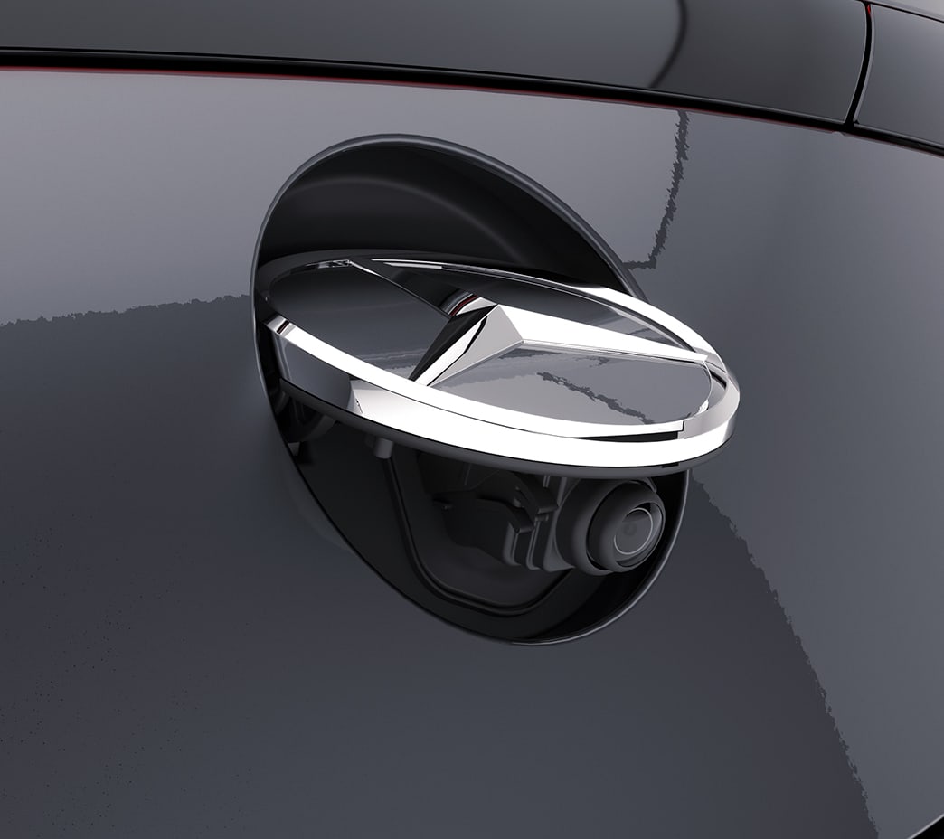 The standard rearview camera is concealed behind the Star ornament, to help keep it clean until it's needed. An available 360 camera system can team up for a virtual birdseye view.